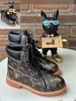Black Monogram Embossed Leather Boots
