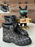 Black Monogram Embossed Leather Boots