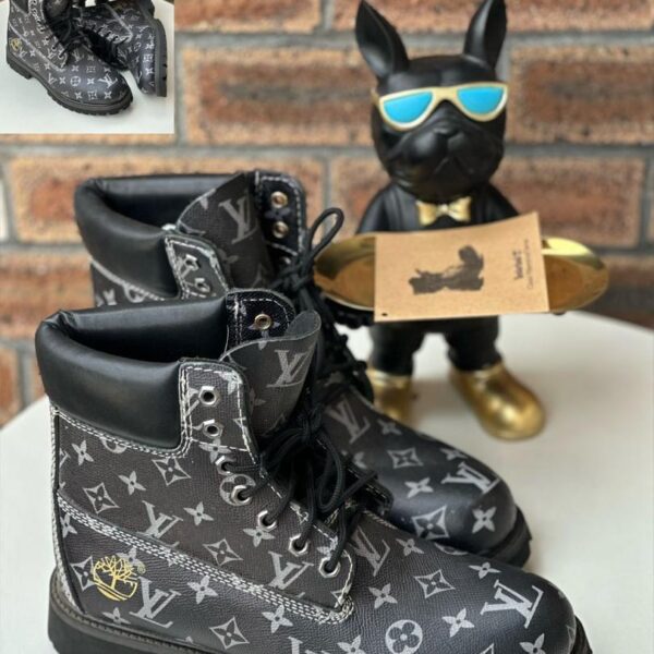Black Monogram Embossed Leather Boots