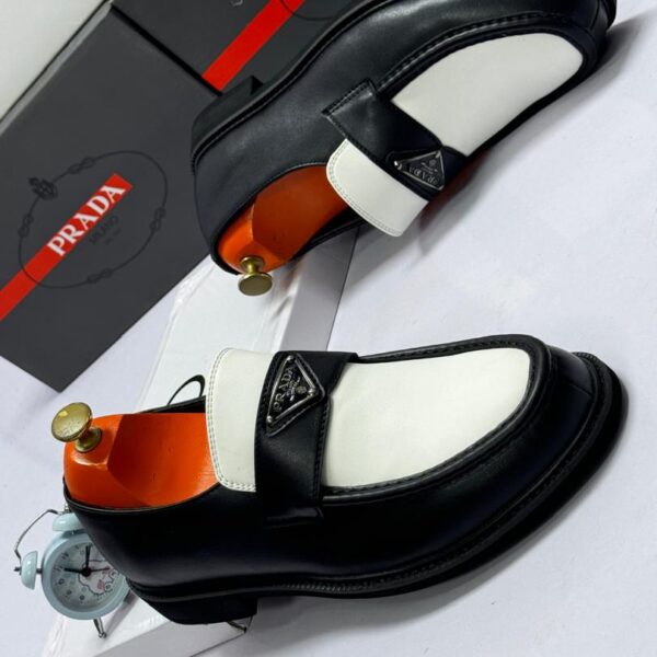 Black & White Leather Loafers with Metal Logo Plaque
