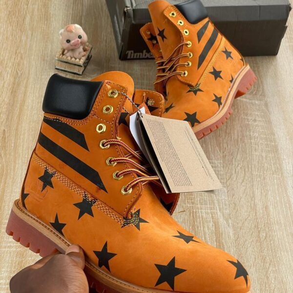 Orange Leather Boots with Black Star Pattern Design