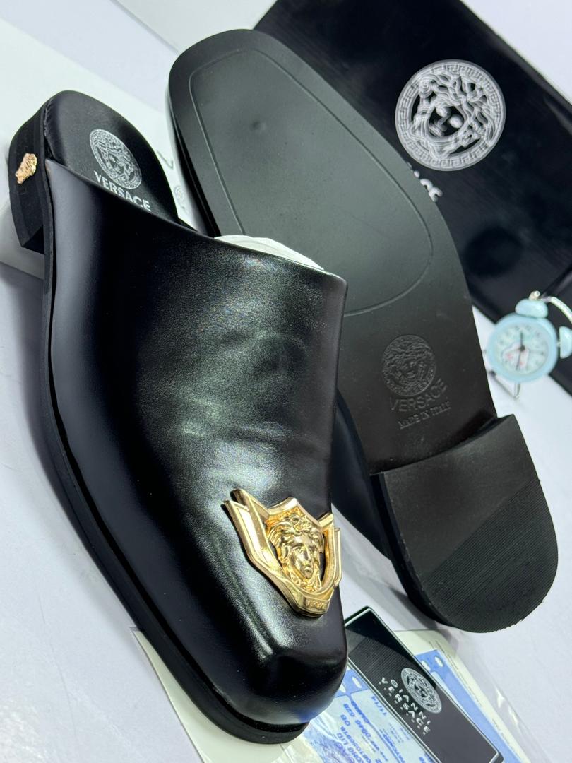 Black Leather Mules with Gold Medusa Logo Black Leather Mules with Gold Medusa Logo