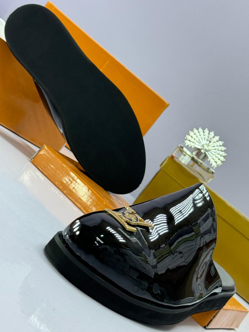 Black Patent Leather Mules with Gold-Tone Emblem Black Patent Leather Mules with Gold-Tone Emblem